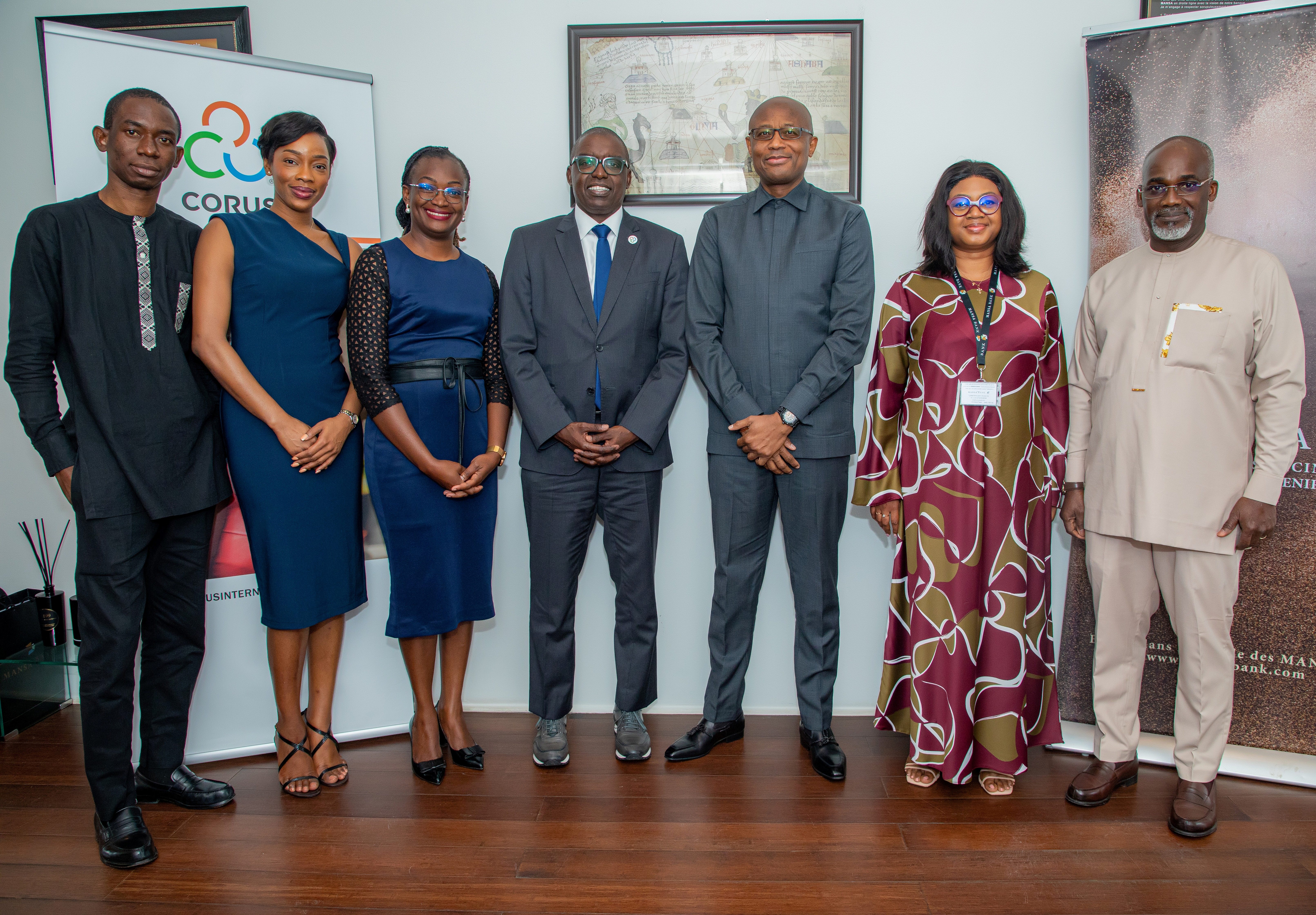 Corus and MANSA BANK Staff pose together after MOU signing.