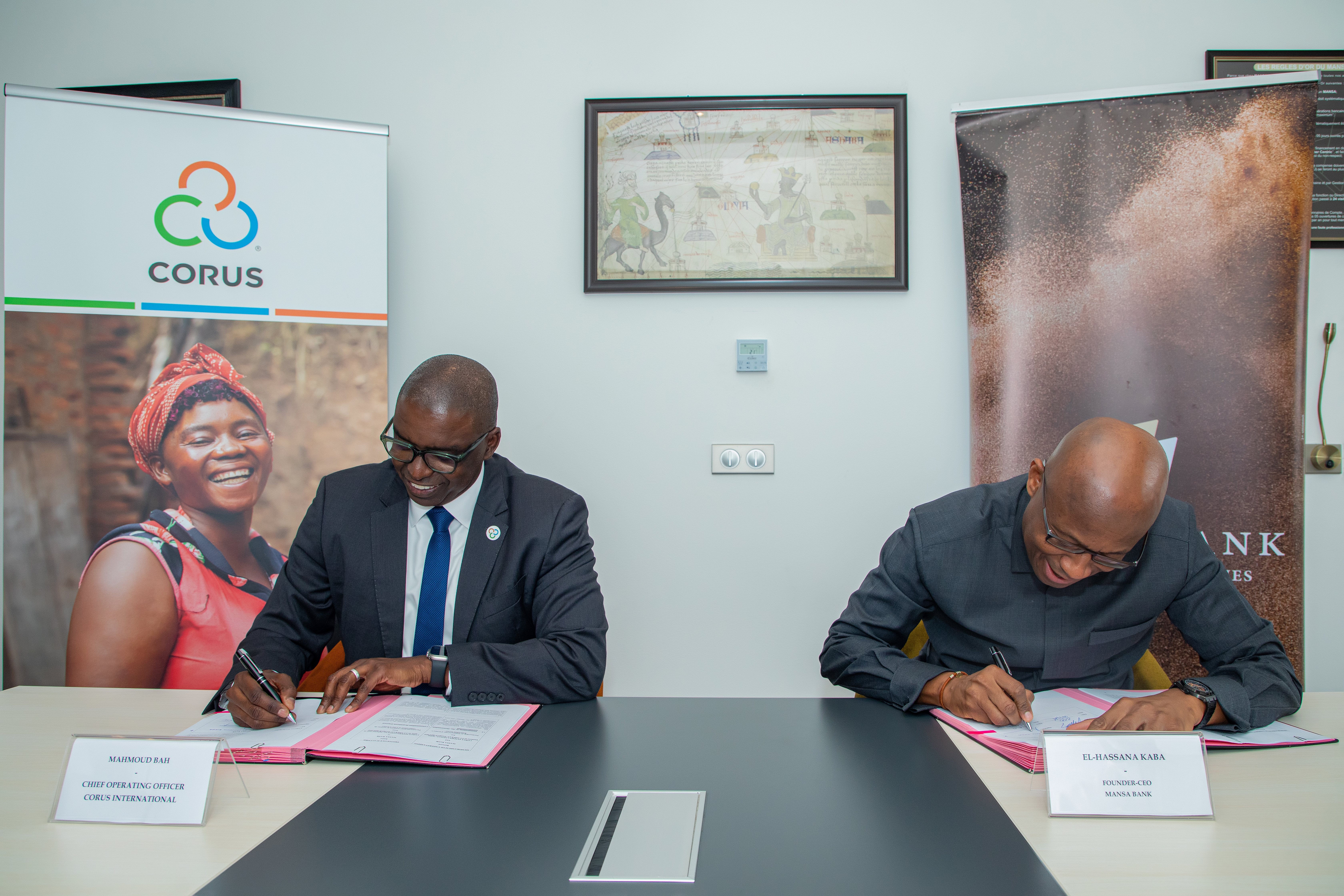 Mahmoud Bah and El-Hassana Kaba sign MOU.