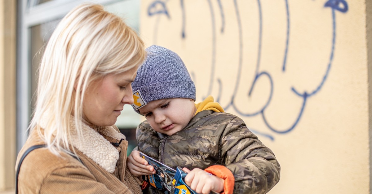 A woman holds a child