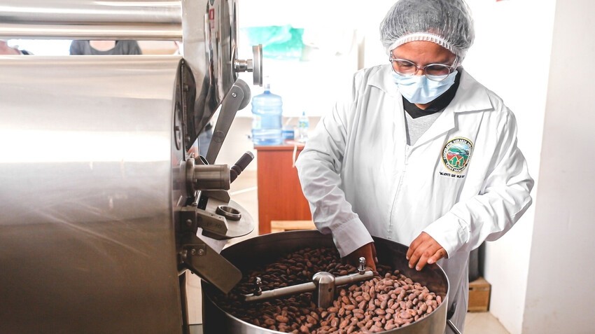 Cocoa paste is processed from raw cacao beans at a Lutheran World Relief-supported facility in Peru