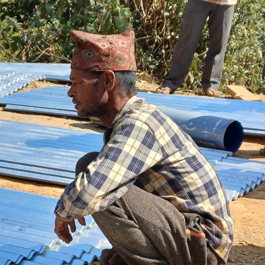 Duddha with building materials for his new home